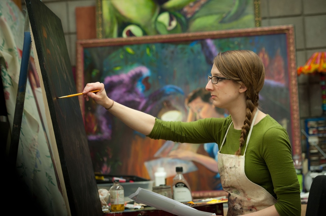 a young girl painting