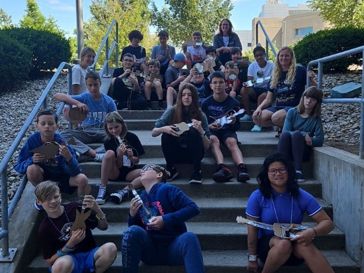 Coders and Creators Camp Kids pose for a group photo with their musical creations.