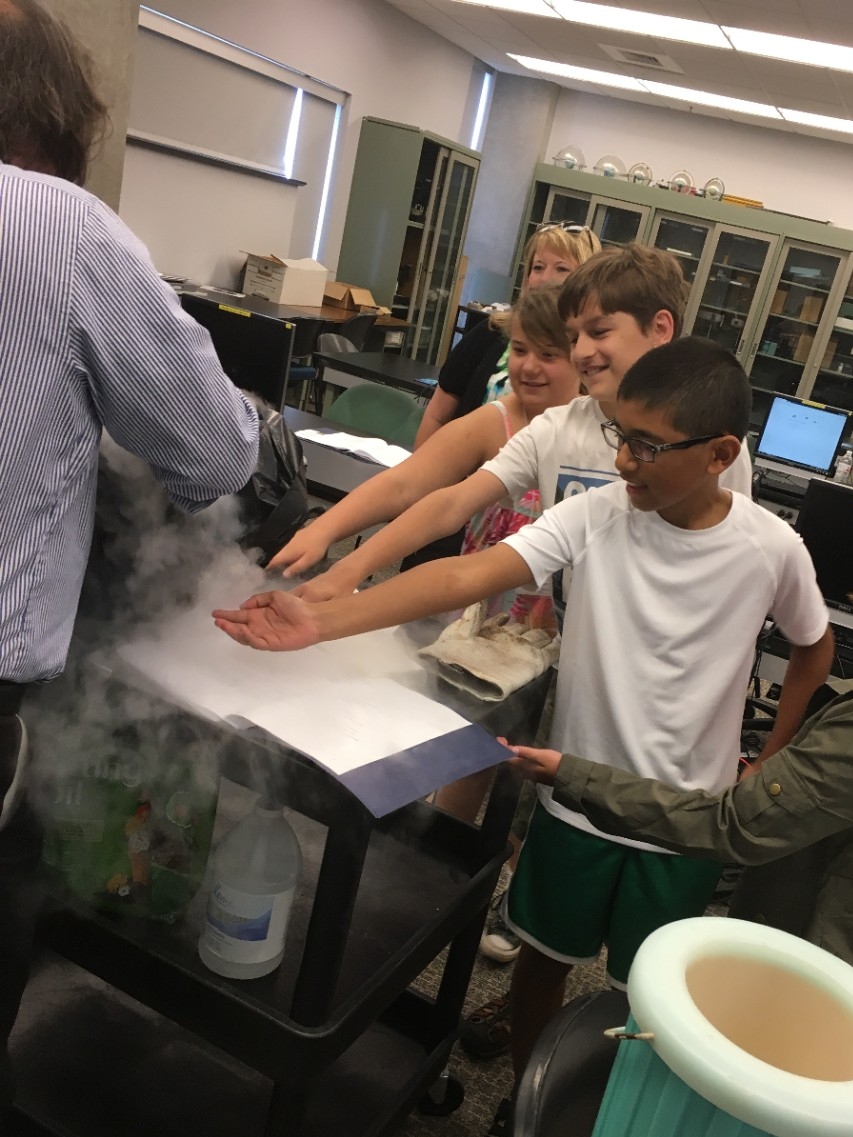 CINSAM Summer Camps School-aged camp participants enjoying a science experiment lead by a NKU faculty member
