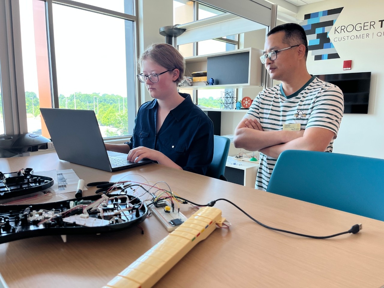 NKU Undergraduate Research in STEM Student researcher and a faculty member doing computing and analytics research in sunny room