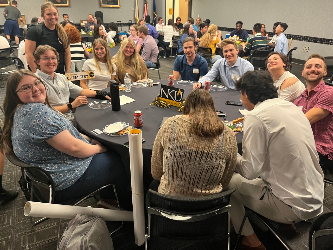 STEM Pizza Suppers STEM majors smiling and having fun together at social event