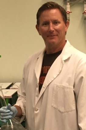 Dr. Thompson conducts research in the lab.