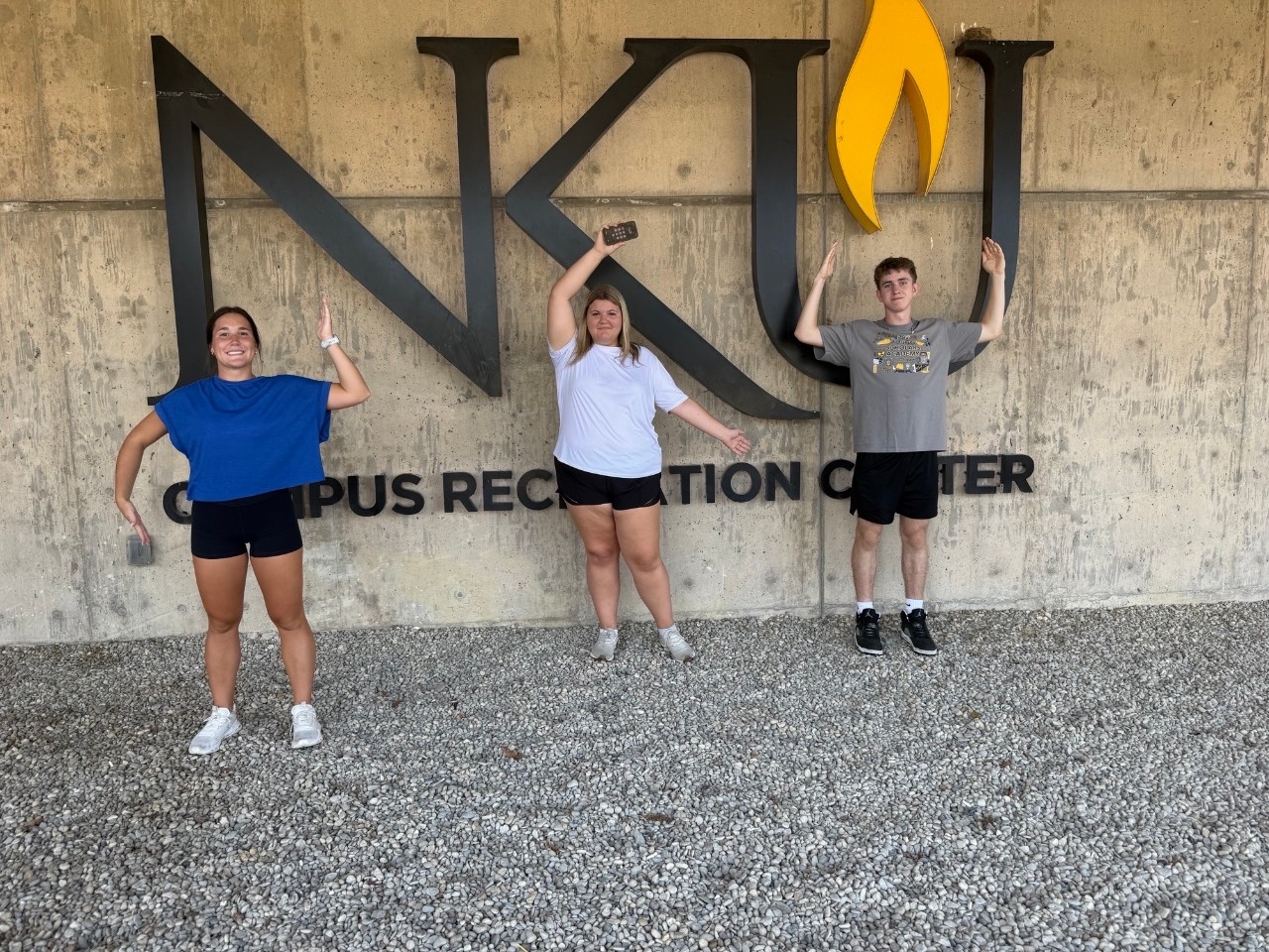 Students spell NKU with their arms