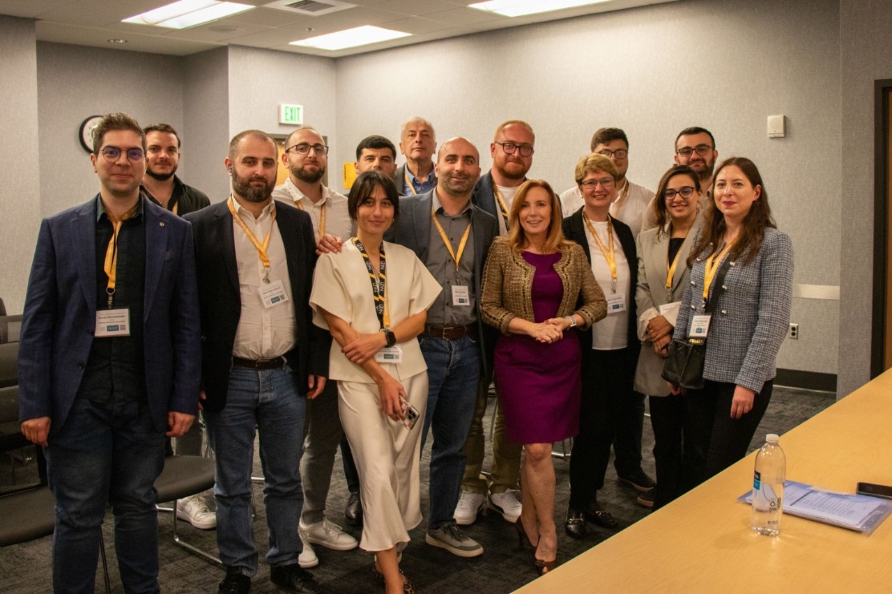 Members of the Saint Andrews Georgian UniversityNKU Master of Cybersecurity cohort pose for a photo with Theresa Payton, keynote speaker for the 17th annual Cybersecurity Symposium.