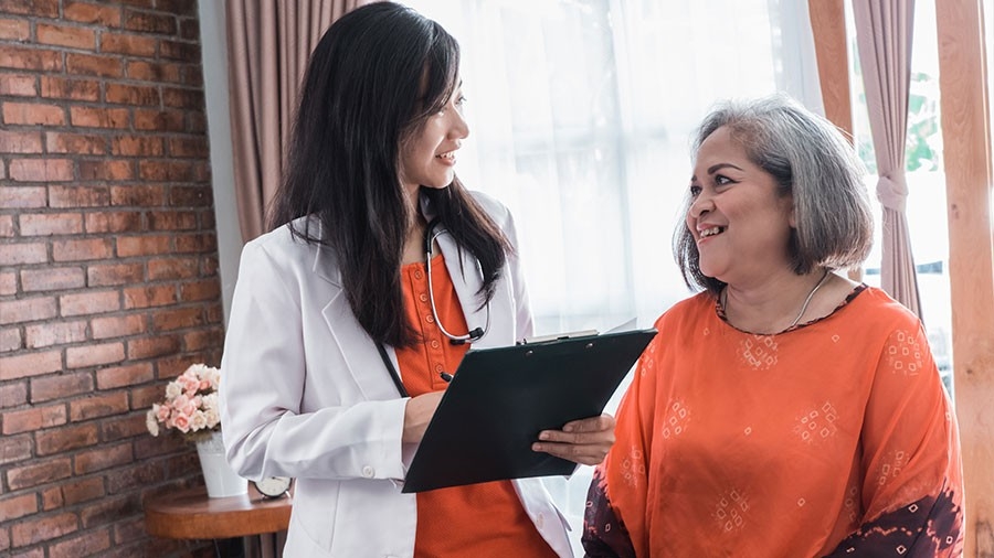 Clinician consulting with a patient