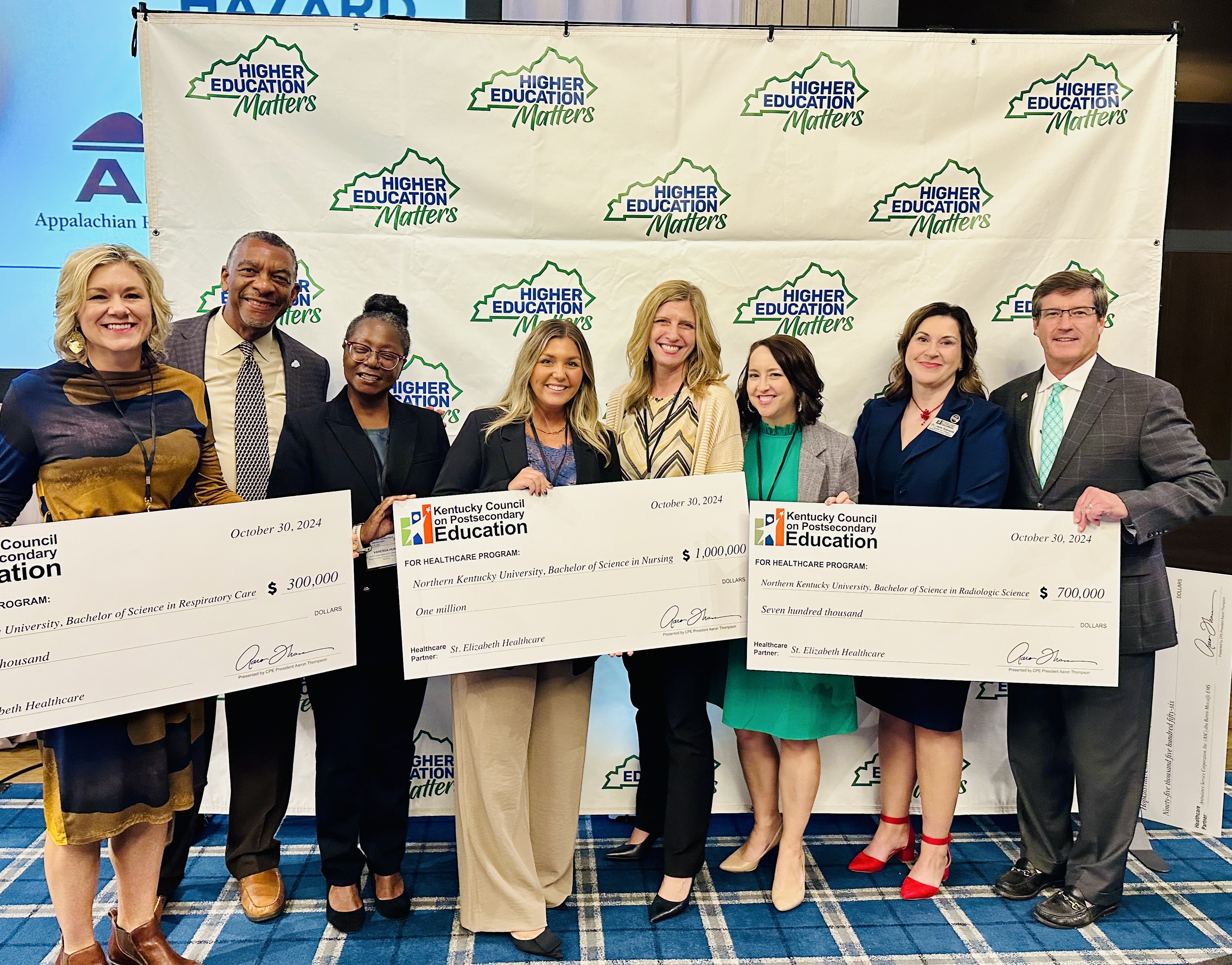 Leaders from NKU's College of Health and Human Services receive check from St. Elizabeth Healthcare, OrththoCincy and CHNK Behavioral Health.